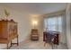 Bright home office offers natural light and ample storage with a built in desk and cabinetry at 2500 Winding Creek Blvd # G307, Clearwater, FL 33761