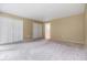 Large bedroom with neutral paint and double closets creating a comfortable space at 2699 Seville Blvd # 207, Clearwater, FL 33764