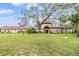 Stately home with tile roof, arched entryway, and lush green lawn creating an inviting curb appeal at 2699 Seville Blvd # 207, Clearwater, FL 33764