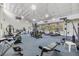 Brightly lit fitness center featuring various cardio and weight training machines for residents at 2699 Seville Blvd # 207, Clearwater, FL 33764