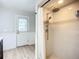 Bathroom featuring a stand-up shower and a door to the outside at 27466 Tierra Del Fuego Cir, Punta Gorda, FL 33983