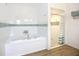 Bright bathroom with soaking tub and walk-in shower with decorative tile at 27466 Tierra Del Fuego Cir, Punta Gorda, FL 33983