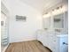 Bright bathroom with a double vanity, modern lighting, and a walk-in shower at 27466 Tierra Del Fuego Cir, Punta Gorda, FL 33983