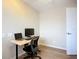 Bright bedroom with a wood-look floor, a modern ceiling fan, and a work-from-home setup at 27466 Tierra Del Fuego Cir, Punta Gorda, FL 33983