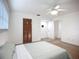 Bright bedroom featuring carpet floors, ceiling fan, and a window offering natural light at 27466 Tierra Del Fuego Cir, Punta Gorda, FL 33983