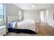 Bedroom with a ceiling fan, updated flooring, and natural light from the windows at 27466 Tierra Del Fuego Cir, Punta Gorda, FL 33983