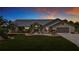Beautiful single-story home with landscaped front yard and attached two-car garage at 27466 Tierra Del Fuego Cir, Punta Gorda, FL 33983