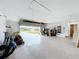 Open garage, ready for parking and storage, with a view to the outdoors through an automatic garage door at 27466 Tierra Del Fuego Cir, Punta Gorda, FL 33983
