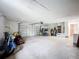 Expansive garage with ample room for parking, storage, and projects and an automatic door at 27466 Tierra Del Fuego Cir, Punta Gorda, FL 33983