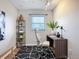 Bright home office featuring a large window, modern desk, and stylish decor at 27466 Tierra Del Fuego Cir, Punta Gorda, FL 33983