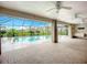 The lanai is fully screened with fans overhead for a lovely outdoor space, just steps from the sparkling pool at 27466 Tierra Del Fuego Cir, Punta Gorda, FL 33983