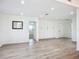 Open living space with light wood floors, built in storage and lots of natural light at 27466 Tierra Del Fuego Cir, Punta Gorda, FL 33983