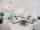 Bright and airy living room with hardwood floors and neutral-toned furniture at 27466 Tierra Del Fuego Cir, Punta Gorda, FL 33983