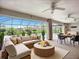 Spacious sunroom with panoramic views, comfortable seating, and access to the pool area at 27466 Tierra Del Fuego Cir, Punta Gorda, FL 33983