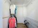 Walk-in closet featuring built-in wire shelving and laminate flooring at 27466 Tierra Del Fuego Cir, Punta Gorda, FL 33983