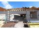 View of home construction showing concrete block walls and lumber for roof in residential neighborhood under blue sky at 2797 Marrakesh Ln, Sarasota, FL 34234