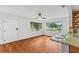 Dining area features hardwood floors, a ceiling fan and modern kitchen view at 2902 W Lemon St, Tampa, FL 33609