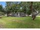 Charming single-story home with a well-manicured lawn and mature trees offering shade at 2902 W Lemon St, Tampa, FL 33609