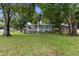 Quaint single-story home with well-maintained lawn and mature trees at 2902 W Lemon St, Tampa, FL 33609