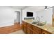 Kitchen island with double sink and seating, perfect for entertaining guests at 2902 W Lemon St, Tampa, FL 33609