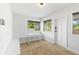 Mud room with seating, windows, and tile floor at 2902 W Lemon St, Tampa, FL 33609