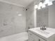 Marble tiled bathroom with sleek vanity and chrome fixtures at 3204 Dodge St, Tampa, FL 33605