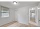 Bright bedroom with tile floors, a window, and closet at 3204 Dodge St, Tampa, FL 33605