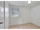 Bright bedroom features neutral walls, window with blinds and tile floors at 3204 Dodge St, Tampa, FL 33605