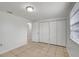 Bedroom featuring a window, access to hallway and closets at 3204 Dodge St, Tampa, FL 33605