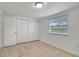 Bedroom with a window and triple closets at 3204 Dodge St, Tampa, FL 33605