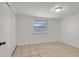 Neutral bedroom with a window and tile floors at 3204 Dodge St, Tampa, FL 33605