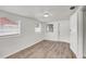 Bright bedroom with modern floors and multiple windows, and a door at 3204 Dodge St, Tampa, FL 33605