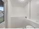 Small hallway with white walls, a door to the outside, and tiled floor at 3204 Dodge St, Tampa, FL 33605