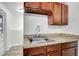 Close up on the kitchen sink, faucet, and cabinetry at 3204 Dodge St, Tampa, FL 33605