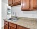 Stainless steel sink and wood cabinetry with ample counter space at 3204 Dodge St, Tampa, FL 33605