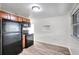 Bright kitchen with modern appliances, wood cabinets and fresh white paint at 3204 Dodge St, Tampa, FL 33605