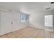 Cozy living room featuring neutral tile flooring, white walls, and natural light at 3204 Dodge St, Tampa, FL 33605
