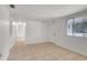 Neutral living room with tile floors and ample natural light at 3204 Dodge St, Tampa, FL 33605