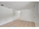 Bright living room featuring neutral tile flooring and freshly painted white walls at 3204 Dodge St, Tampa, FL 33605
