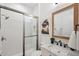 Bathroom featuring a tiled shower with glass door and a vanity with marble countertop at 32490 Tree Of Life Ave, Wesley Chapel, FL 33543