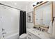 Modern bathroom featuring marble sink, tub and shower combination, and neutral colors at 32490 Tree Of Life Ave, Wesley Chapel, FL 33543