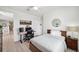 Bedroom showcasing a modern desk and a comfortable bed, perfect for relaxation at 32490 Tree Of Life Ave, Wesley Chapel, FL 33543