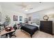 This bedroom has a computer desk, music, and bedroom decor, perfect for relaxation at 32490 Tree Of Life Ave, Wesley Chapel, FL 33543