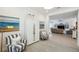 Entryway with beachy decor, seating, and view into the open concept living areas at 32490 Tree Of Life Ave, Wesley Chapel, FL 33543
