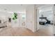 Bright hallway with open view to the living area and inviting bedroom suite at 32490 Tree Of Life Ave, Wesley Chapel, FL 33543