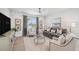 Bright living room with modern furnishings, neutral tones, and ample natural light at 32490 Tree Of Life Ave, Wesley Chapel, FL 33543