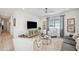 Modern living room with sleek TV, stylish seating, and elegant decor at 32490 Tree Of Life Ave, Wesley Chapel, FL 33543