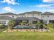 Aerial view of screened-in pool with landscaping in backyard at 32490 Tree Of Life Ave, Wesley Chapel, FL 33543