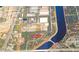Overhead shot of land with road access, surrounded by commercial buildings and a waterway at 4210 Garden Ln, Tampa, FL 33610
