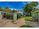 Expansive backyard with well-maintained lawn, charming patios, and lush landscaping creating a private retreat at 4742 13Th N Ave, St Petersburg, FL 33713